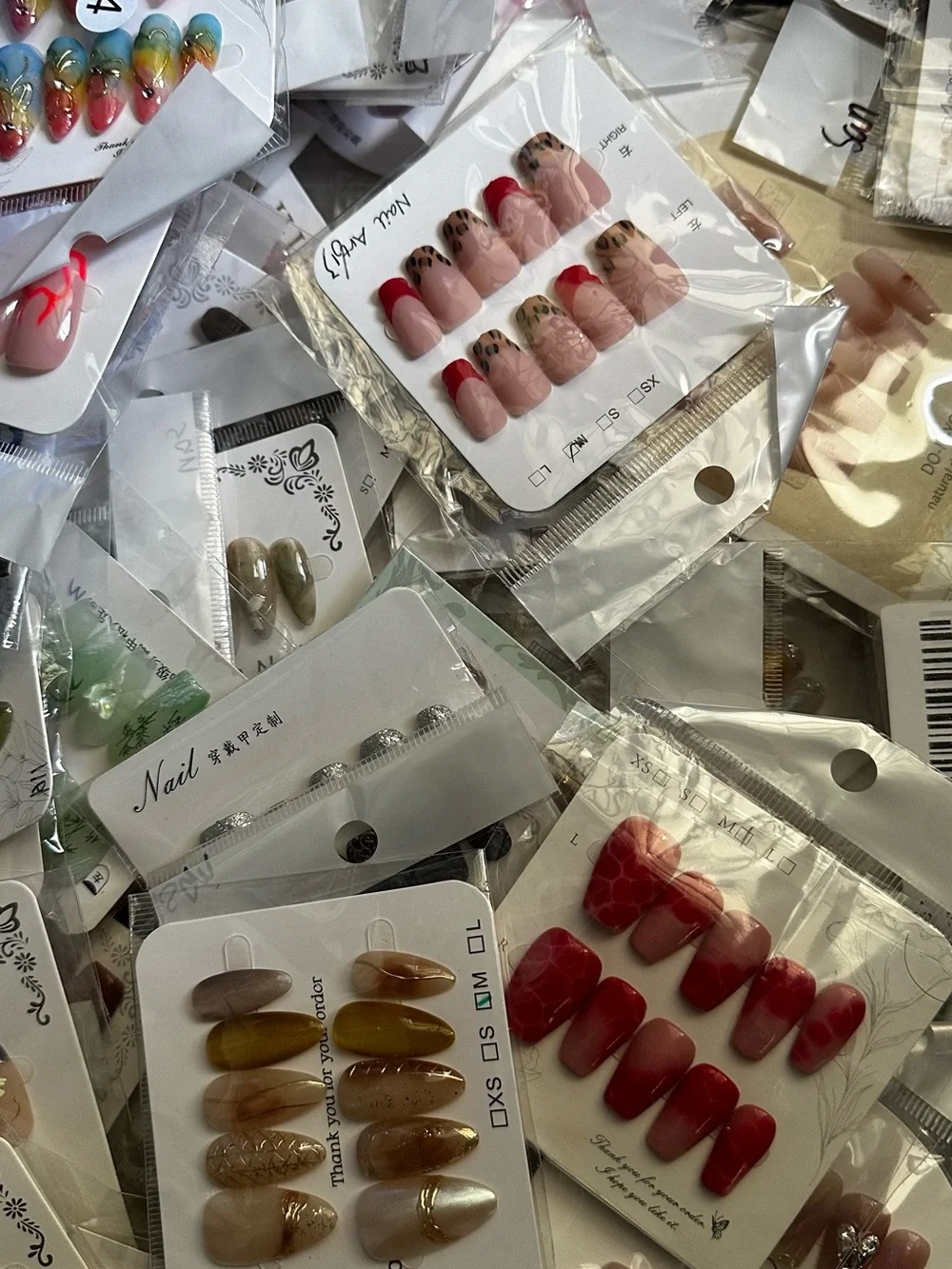 100 Sets of SURPRISE Assorted Press-On Nail Sets - Floral, Pink, Blue, Neutral